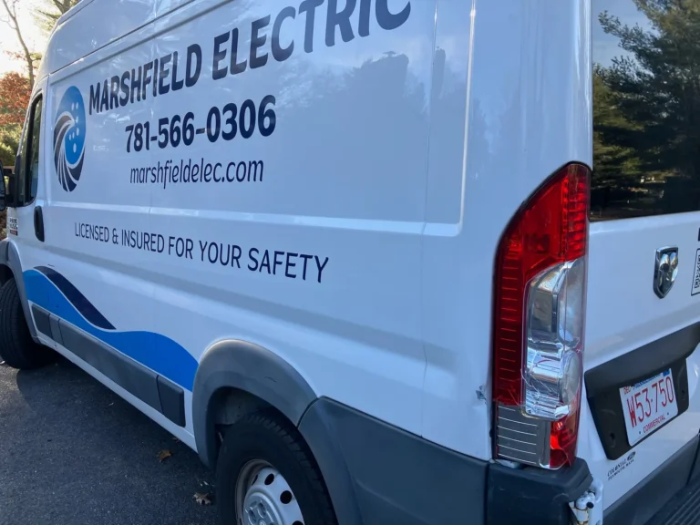 A van featuring the text "Marshfield Electric" on its exterior, showcasing a clean and professional appearance.