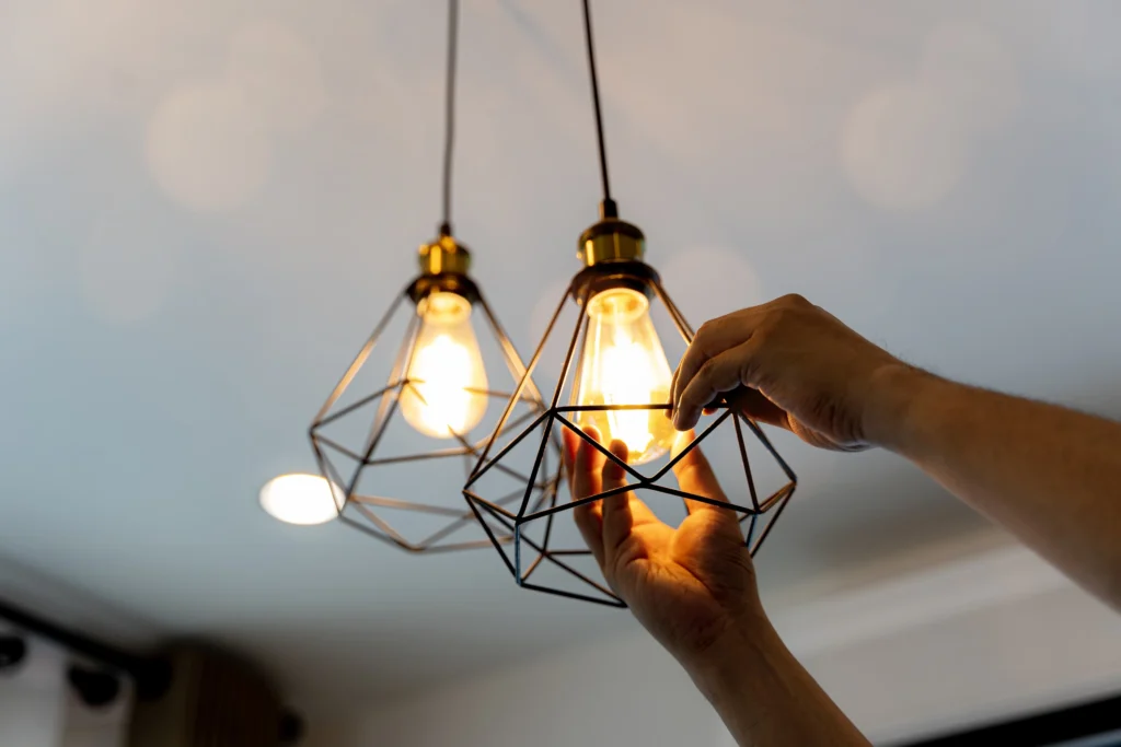 A Hingham electrician installs pendant lighting